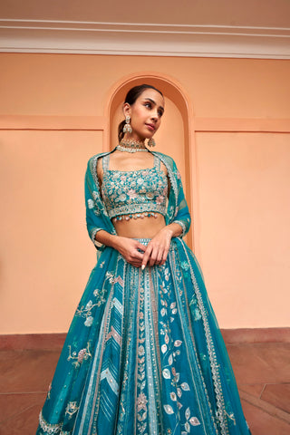 Front view of pine green lehenga with floral embroidered scoop-neck blouse and dupatta by Osaa by Adarsh at Mrs. G