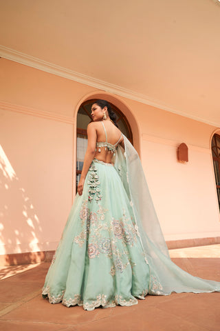 Back view of cadet blue lehenga with strappy bralette, floral skirt and organza dupatta by Osaa by Adarsh at Mrs. G