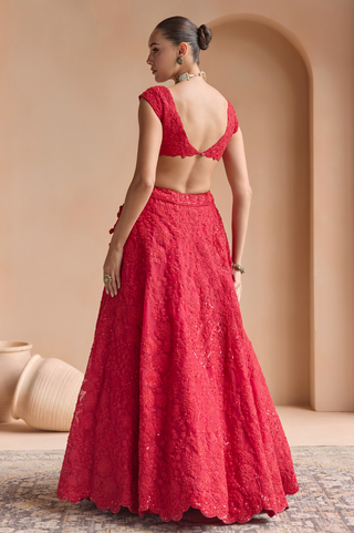 Back view of rosewood red lehenga set with low scoop back blouse and scalloped skirt hem by Osaa by Adarsh at Mrs. G