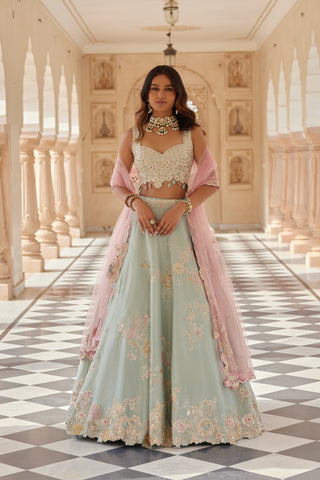 Front view of tea green lehenga with sweetheart embroidered blouse and pink net dupatta by Osaa by Adarsh at Mrs. G