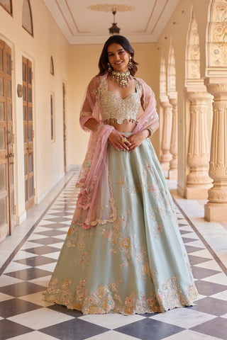 Three-quarter view of tea green floral embroidered lehenga with pink dupatta by Osaa by Adarsh at Mrs. G