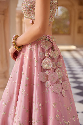 Close-up of flamingo pink lehenga waistband with flower latkan and sequin skirt by Osaa by Adarsh at Mrs. G