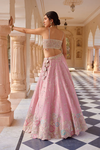 Back view of flamingo pink strappy bralette and lehenga with applique hem border by Osaa by Adarsh at Mrs. G