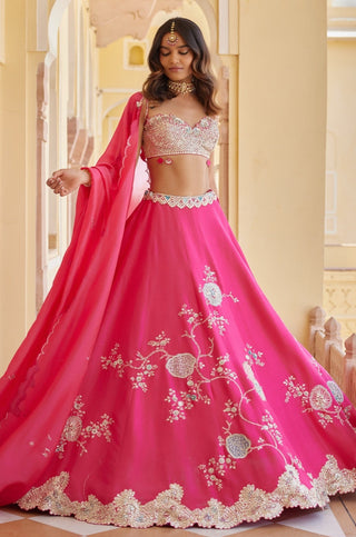 Twirling view of dark fuchsia lehenga with floral vine embroidery and scalloped silver hem by Osaa by Adarsh at Mrs. G