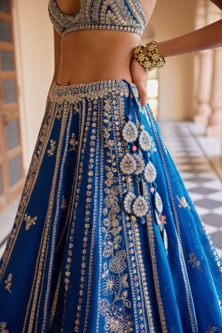 Close-up of jade blue lehenga waistband with tassel latkan and gold zardozi panels by Osaa by Adarsh at Mrs. G