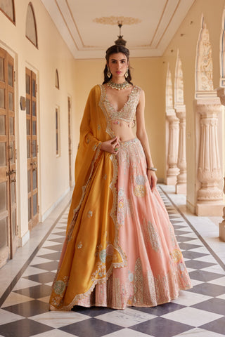 Front view of salmon peach lehenga with deep V blouse and mustard organza dupatta by Osaa by Adarsh at Mrs. G