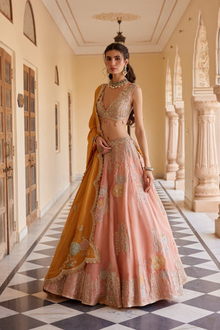 Front view of salmon peach flared lehenga with vertical zardozi stripes and hem band by Osaa by Adarsh at Mrs. G