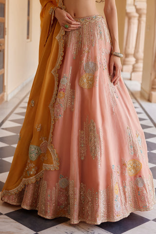 Close-up of salmon peach lehenga skirt with multicolor circular motifs and zardozi stripes by Osaa by Adarsh at Mrs. G