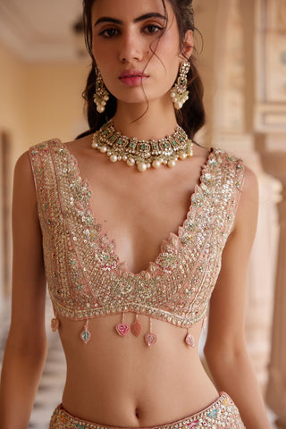 Close-up of salmon peach deep V blouse with sequin lattice work and leaf tassels by Osaa by Adarsh at Mrs. G