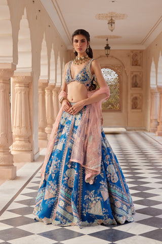 Front view of blueberry lehenga with patchwork applique panels and peach pink net dupatta by Osaa by Adarsh at Mrs. G