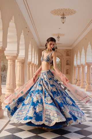 Twirling view of blueberry lehenga with patchwork applique skirt and scalloped hem by Osaa by Adarsh at Mrs. G