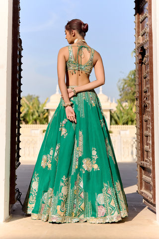 Back view of jewel green lehenga with tie-back blouse and patches of thread embroidery by Osaa by Adarsh at Mrs. G