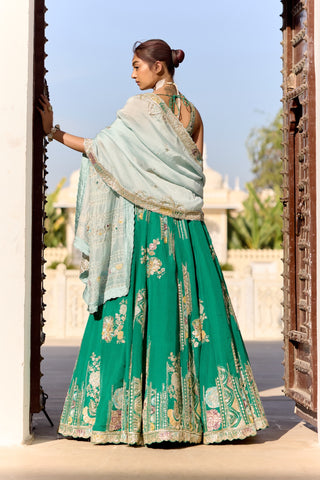Back view of jewel green lehenga with pale aqua dupatta over the shoulder by Osaa by Adarsh at Mrs. G