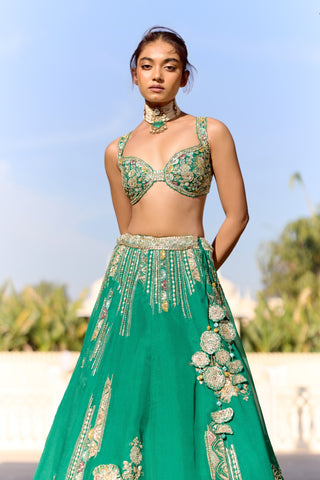 Close view of jewel green blouse and zardozi stripes at the lehenga waistband by Osaa by Adarsh at Mrs. G
