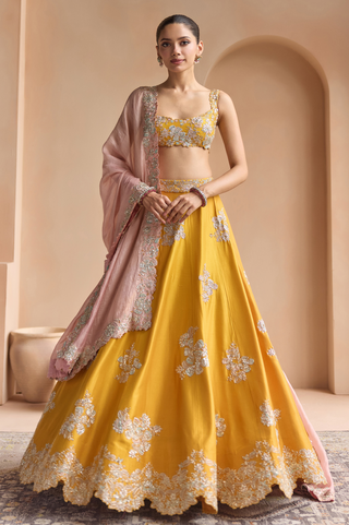 Front view of marigold lehenga set with scoop neck blouse, blush pink dupatta and floral hem border by Osaa by Adarsh at Mrs. G
