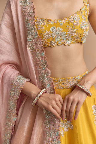 Close-up of marigold blouse and blush pink dupatta with pastel flower embroidery by Osaa by Adarsh at Mrs. G