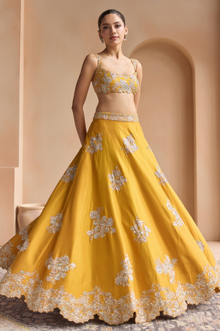 Twirl view of marigold full skirt with silver flower motifs and scalloped floral hem by Osaa by Adarsh at Mrs. G
