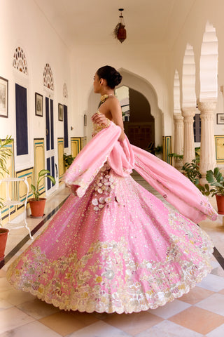 Side view of rosaline pink lehenga spinning with fabric flowers at the hip by Osaa by Adarsh at Mrs. G