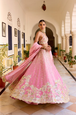 Three-quarter view of rosaline pink lehenga with a wide flare and floral border by Osaa by Adarsh at Mrs. G