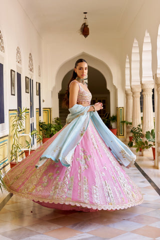 Side view of rosaline pink lehenga spinning with zardozi stripes and powder blue dupatta by Osaa by Adarsh at Mrs. G