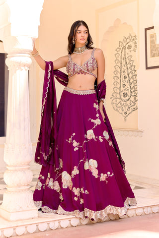 Three-quarter view of dark plum lehenga with a plain waist and embroidered hem by Osaa by Adarsh at Mrs. G
