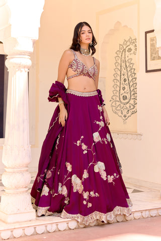 Front view of dark plum lehenga with flower branch embroidery and a wrap-style blouse by Osaa by Adarsh at Mrs. G