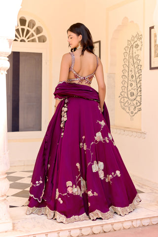 Back view of dark plum lehenga with a low-back blouse and tassel at the hip by Osaa by Adarsh at Mrs. G