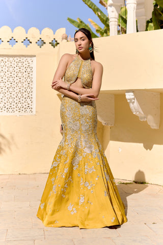 Front view of canary yellow fish cut lehenga with a halter top and silver zardozi flowers by Osaa by Adarsh at Mrs. G