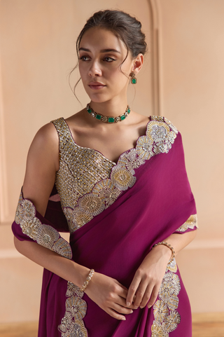 Waist-up view of aubergine saree pallu with large flower border and gold trellis blouse by Osaa by Adarsh at Mrs. G