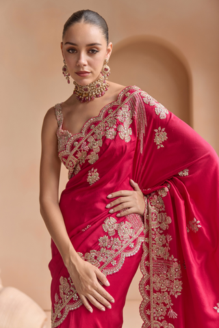 Waist-up view of chilli red saree pallu with scalloped flower border and beaded fringe lines by Osaa by Adarsh at Mrs. G