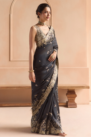 Side view of black organza saree with gold sequin border and scattered sequin motifs by Osaa by Adarsh at Mrs. G
