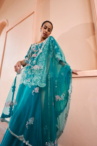 Close-up of pine green net dupatta with floral embroidery over the embroidered kurta by Osaa by Adarsh at Mrs. G