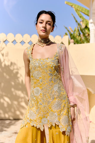 Waist-up view of canary yellow square-neck kurta with zardozi flowers, pearls and pink dupatta by Osaa by Adarsh at Mrs. G