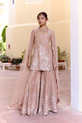 Front view of caramel taupe sharara set with a strappy sequin kurta and net cape dupatta by Osaa by Adarsh at Mrs. G