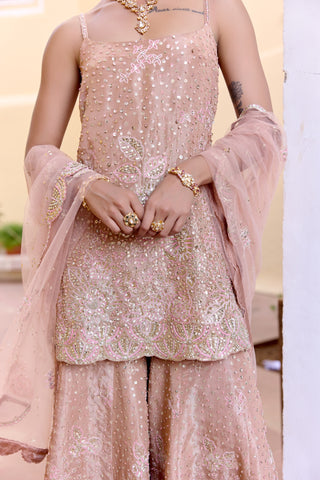 Waist-up view of caramel taupe scoop-neck kurta with sequins, pearls and pink thread leaves by Osaa by Adarsh at Mrs. G