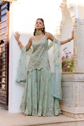 Front view of sage strappy kurta and wide sharara with shell motifs and a blue dupatta by Osaa by Adarsh at Mrs. G