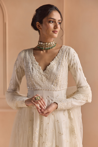 Close-up of ivory anarkali bodice with scalloped V-neckline, pearl and thread embroidery by Osaa by Adarsh at Mrs. G