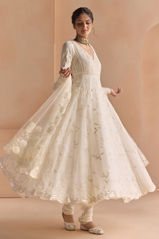 Twirl view of ivory flared anarkali with scalloped sequin hem and floral dupatta border by Osaa by Adarsh at Mrs. G