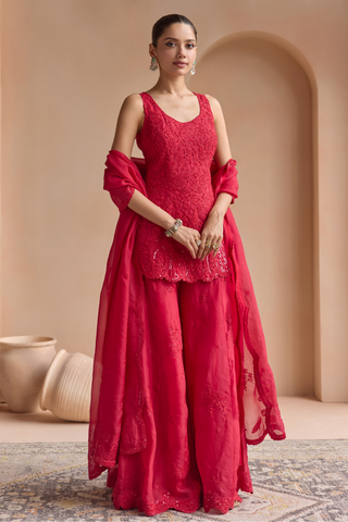 Front view of rosewood red short kurta with wide sharara and organza dupatta with scalloped border by Osaa by Adarsh at Mrs. G