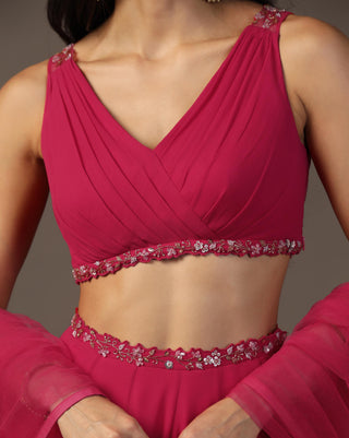 Bright pink draped blouse and lehenga set