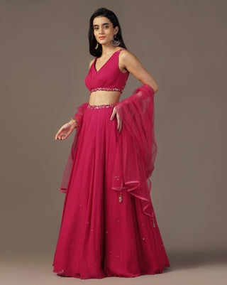 Bright pink draped blouse and lehenga set
