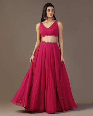 Bright pink draped blouse and lehenga set