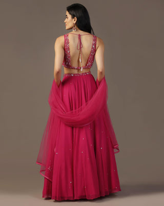 Bright pink draped blouse and lehenga set