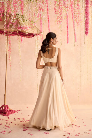 Ivory primrose under bloom lehenga set