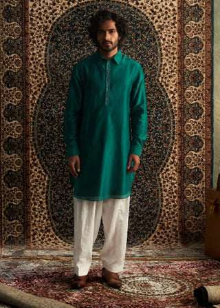 Emerald green pathani kurta and white salwar