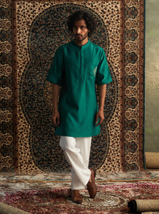 Emerald green kurta and white pyjamas