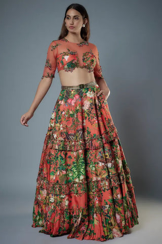 Orange sheer net embroidered blouse with layered frill lehenga
