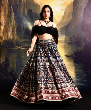 Black printed suede lehenga with a pleated embroidered blouse