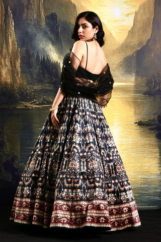 Black printed suede lehenga with a pleated embroidered blouse