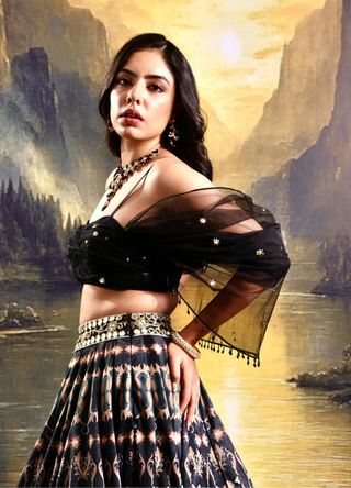 Black printed suede lehenga with a pleated embroidered blouse